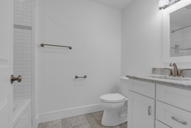 full bathroom with vanity, toilet, and tiled shower / bath combo