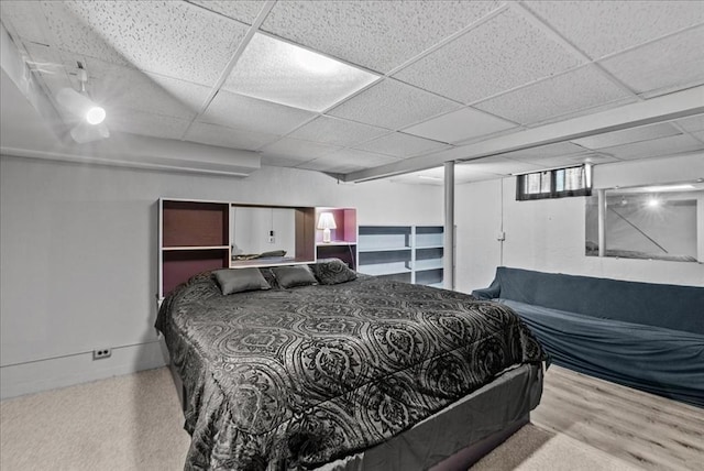 bedroom with a paneled ceiling