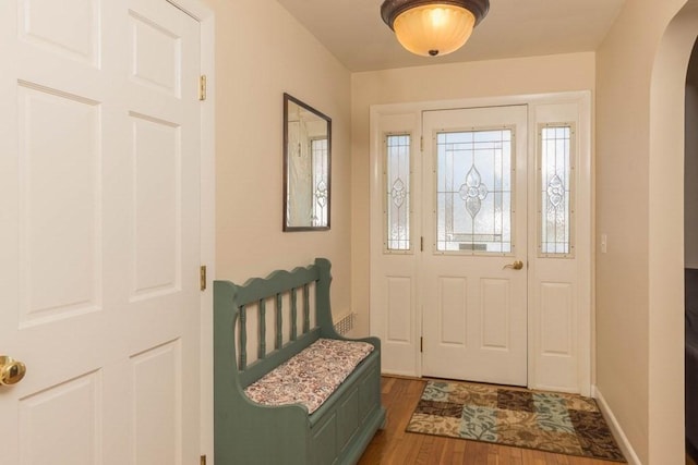 entryway with dark hardwood / wood-style floors