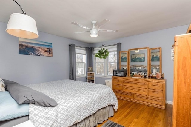 bedroom featuring wood-type flooring and ceiling fan