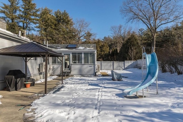 exterior space with a gazebo and a sunroom