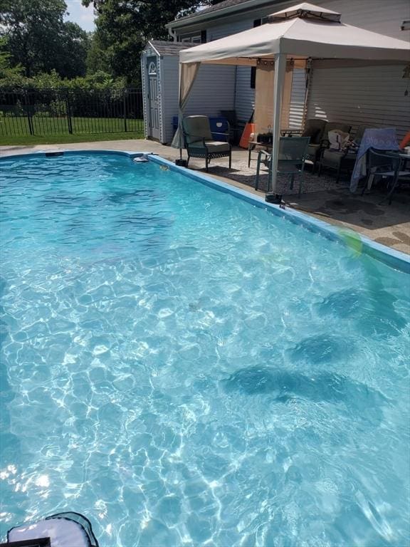 view of pool with a gazebo and a patio