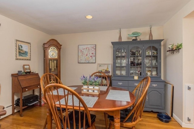 dining space featuring light wood-type flooring