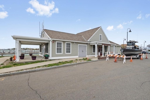 view of front of property with roof with shingles