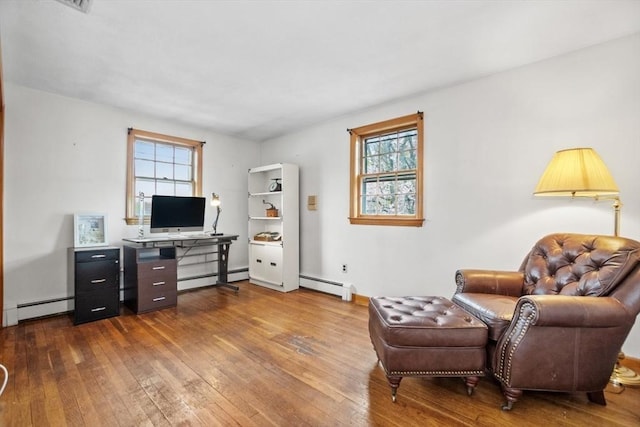 interior space with hardwood / wood-style flooring and a baseboard radiator