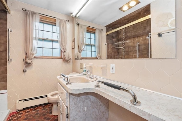 full bath with vanity, a stall shower, toilet, and a baseboard radiator