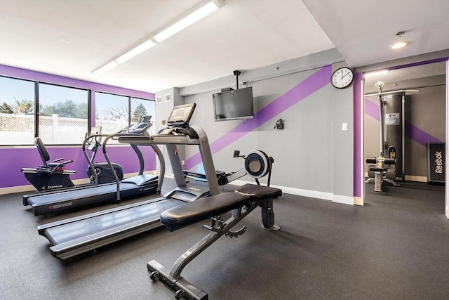 exercise room with baseboards