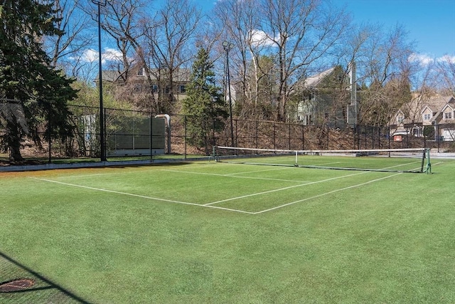 view of tennis court with fence