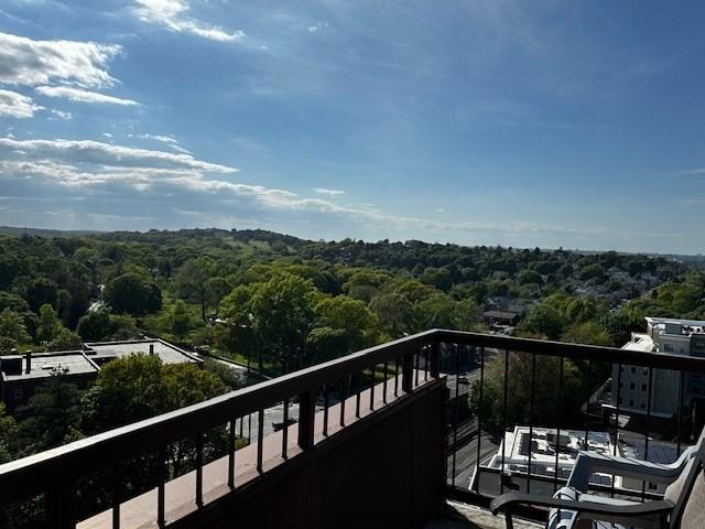 77 Adams St Unit 1201, Quincy, MA 02169 - balcony featuring a wooded view