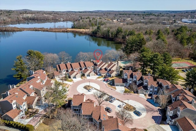 birds eye view of property with a residential view and a water view