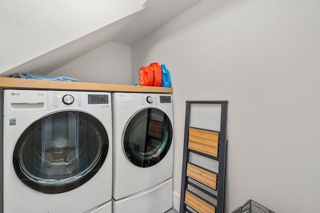 washroom featuring washer and dryer and laundry area