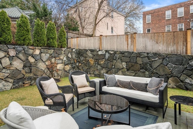 view of patio featuring outdoor lounge area and fence private yard