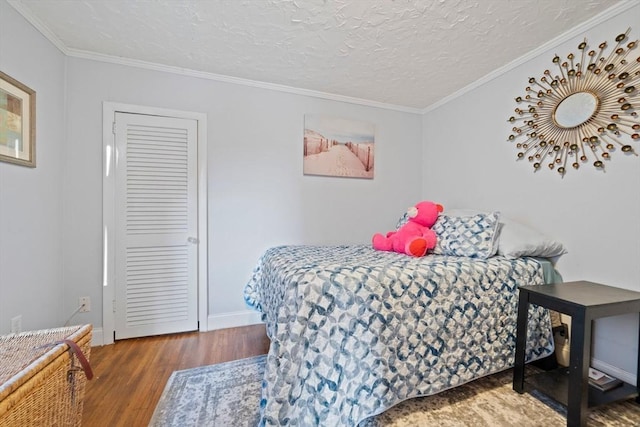 19 Borden, Scituate, MA 02066 - bedroom with wood finished floors, ornamental molding, and a textured ceiling