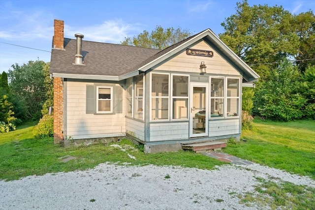 19 Borden, Scituate, MA 02066 - rear view of property with a chimney, roof with shingles, a sunroom, and a yard