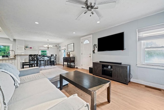 19 Borden, Scituate, MA 02066 - living room featuring light wood-type flooring, a chandelier, healthy amount of natural light, a ceiling fan, and recessed lighting