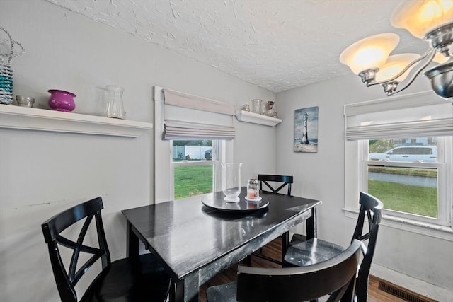 19 Borden, Scituate, MA 02066 - dining area featuring a textured ceiling, wood finished floors, and a water view