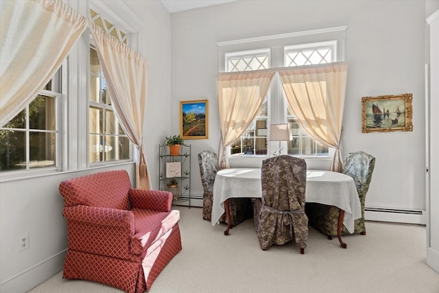 dining space with carpet flooring and baseboard heating