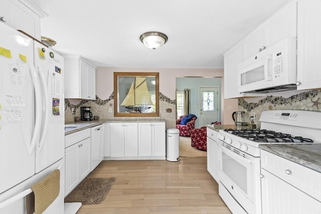 6 N Rd, Mattapoisett, MA 02739 - kitchen featuring white appliances, backsplash, light wood-type flooring, white cabinets, and light stone countertops