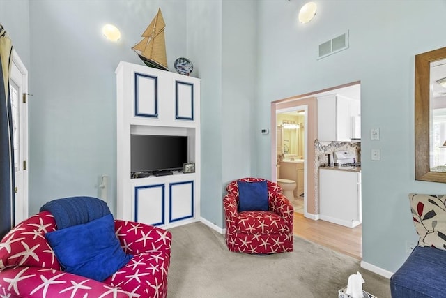 6 N Rd, Mattapoisett, MA 02739 - carpeted living area with a high ceiling and baseboards