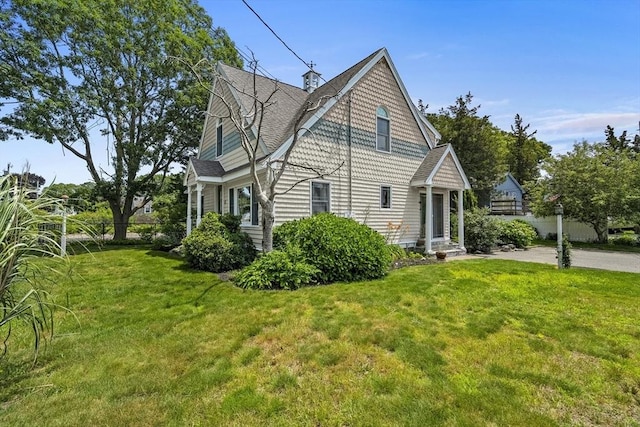 6 N Rd, Mattapoisett, MA 02739 - view of side of property with a yard and roof with shingles