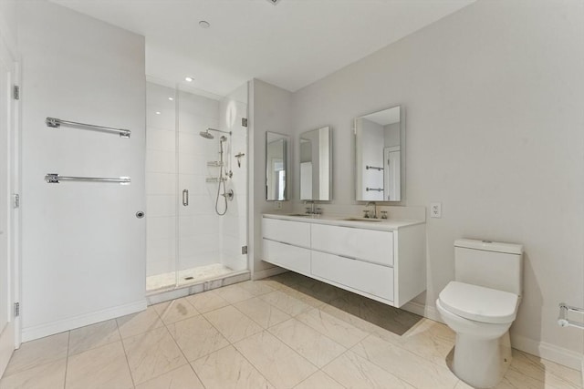 bathroom with a shower stall, toilet, baseboards, double vanity, and recessed lighting