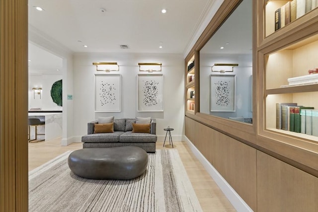 lobby featuring ornamental molding and recessed lighting