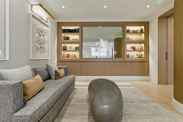 living room featuring wood finished floors, recessed lighting, ornamental molding, and baseboards