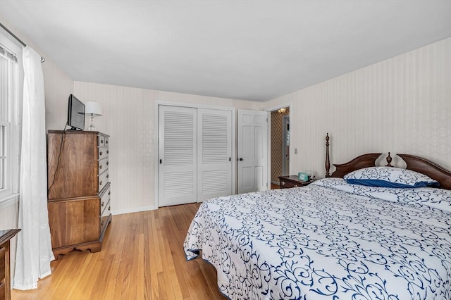 bedroom featuring a closet and wood finished floors