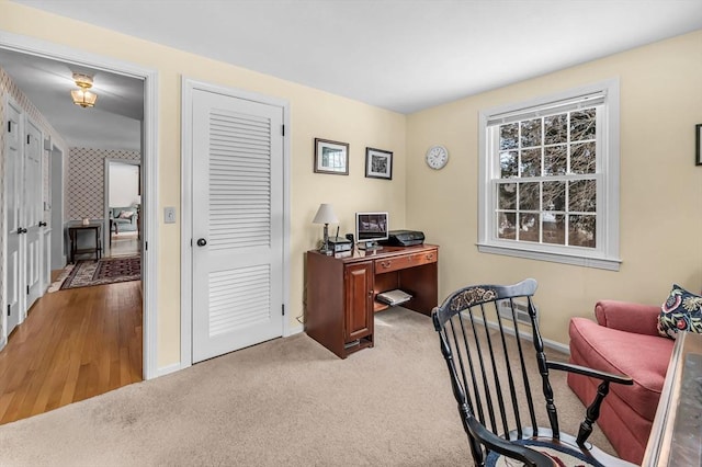 carpeted office with baseboards