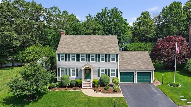 2 Christin Way, Woburn, MA 01801 - colonial home with an attached garage, asphalt driveway, a chimney, and a front yard
