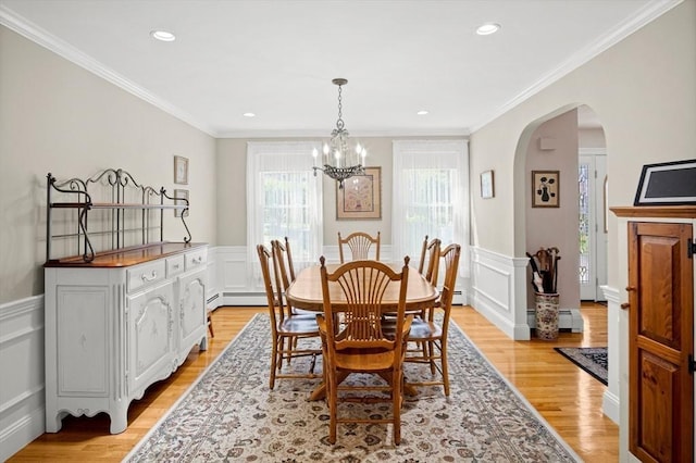 2 Christin Way, Woburn, MA 01801 - dining room with plenty of natural light, a chandelier, a decorative wall, light wood finished floors, and wainscoting