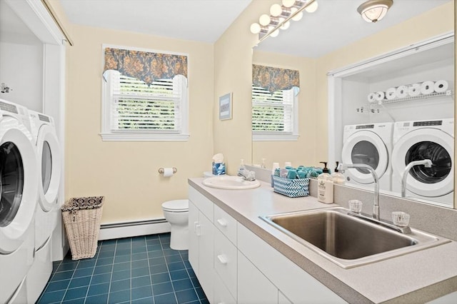 2 Christin Way, Woburn, MA 01801 - laundry room featuring baseboard heating, separate washer and dryer, and dark tile patterned flooring