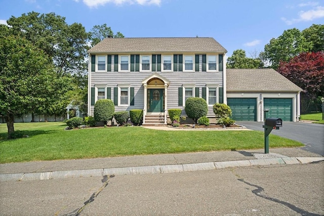 2 Christin Way, Woburn, MA 01801 - colonial home featuring a garage, a front yard, driveway, and roof with shingles