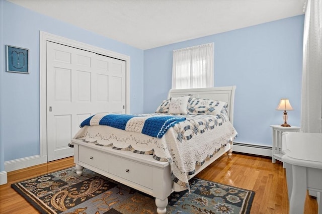 2 Christin Way, Woburn, MA 01801 - bedroom featuring a baseboard radiator, wood finished floors, and a closet