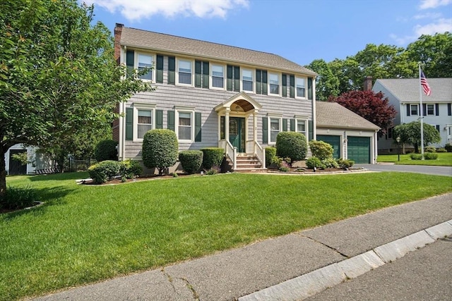 2 Christin Way, Woburn, MA 01801 - colonial home with driveway, a chimney, an attached garage, and a front lawn