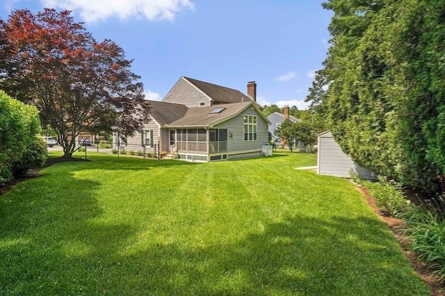 2 Christin Way, Woburn, MA 01801 - back of property with a sunroom, a lawn, and a chimney