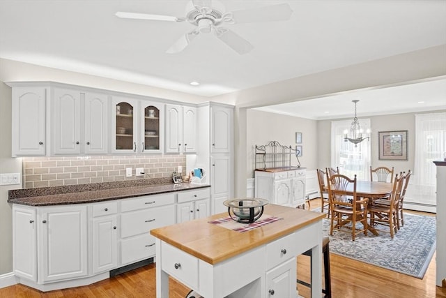 2 Christin Way, Woburn, MA 01801 - kitchen featuring light wood-style flooring, white cabinets, decorative backsplash, glass insert cabinets, and recessed lighting
