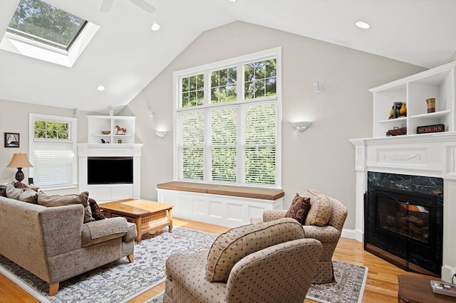 2 Christin Way, Woburn, MA 01801 - living area featuring a premium fireplace, light wood-style floors, plenty of natural light, vaulted ceiling, and recessed lighting