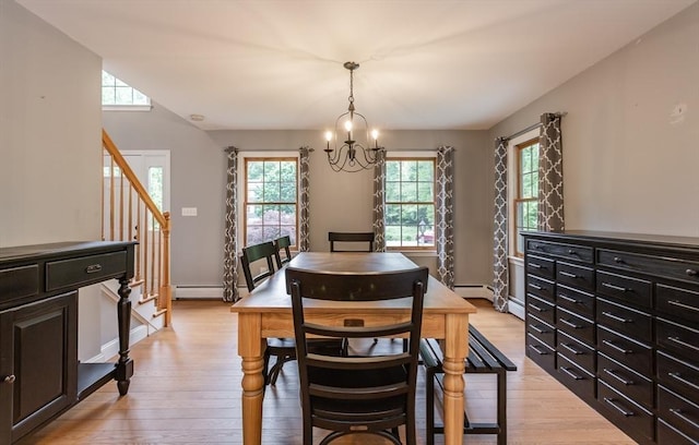 16 Austin Ln, Acushnet, MA 02743 - dining room featuring a chandelier, stairs, light wood-style flooring, a baseboard heating unit, and baseboards