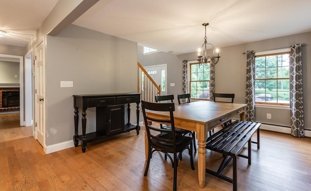 16 Austin Ln, Acushnet, MA 02743 - dining area with light wood-style floors, healthy amount of natural light, stairs, and a chandelier