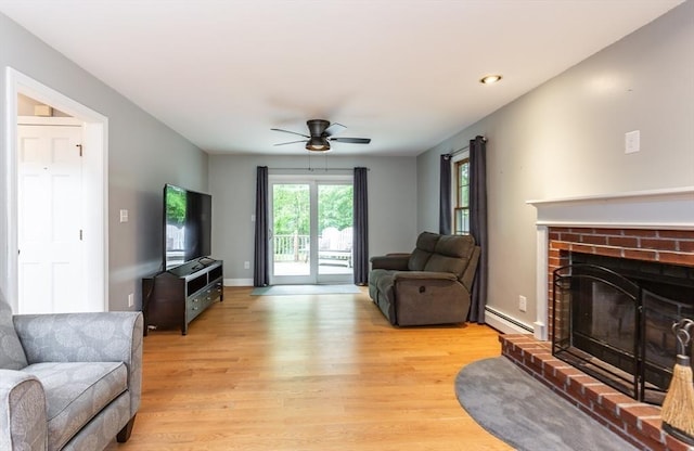 16 Austin Ln, Acushnet, MA 02743 - living room featuring light wood-style floors, a ceiling fan, a brick fireplace, baseboard heating, and recessed lighting