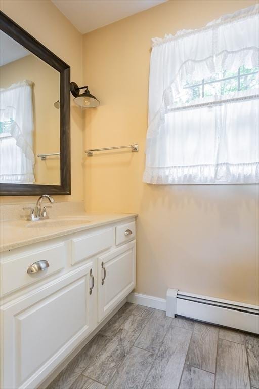 16 Austin Ln, Acushnet, MA 02743 - bathroom featuring a baseboard radiator, vanity, and baseboards