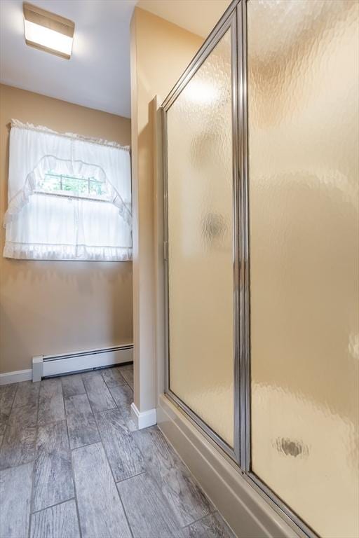 16 Austin Ln, Acushnet, MA 02743 - full bath featuring a baseboard heating unit, a stall shower, baseboards, and wood finished floors
