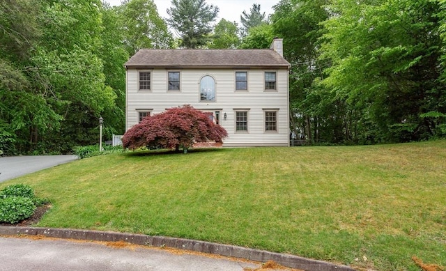 16 Austin Ln, Acushnet, MA 02743 - colonial-style house featuring a chimney and a front lawn