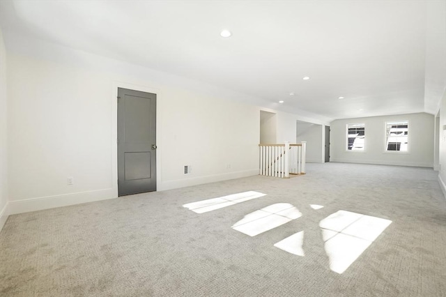 unfurnished room with light carpet