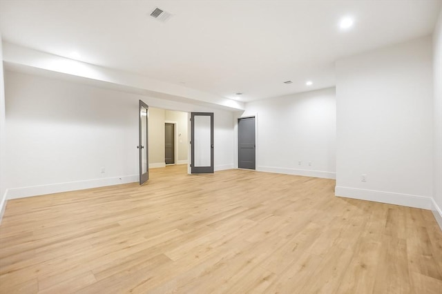 unfurnished room featuring light hardwood / wood-style flooring