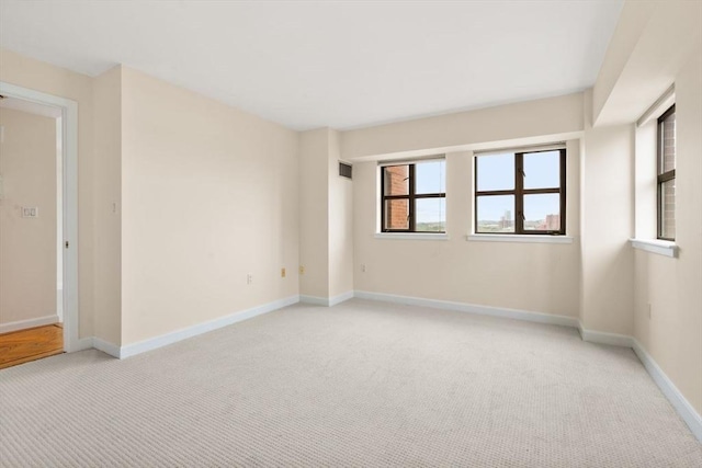 931 Massachusetts Ave Unit 1003, Cambridge, MA 02139 - unfurnished room with light carpet and baseboards