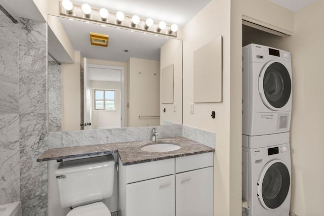 931 Massachusetts Ave Unit 1003, Cambridge, MA 02139 - full bath featuring stacked washer and clothes dryer, vanity, and a shower