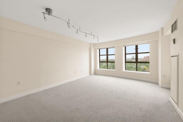 931 Massachusetts Ave Unit 1003, Cambridge, MA 02139 - unfurnished room featuring track lighting and light carpet