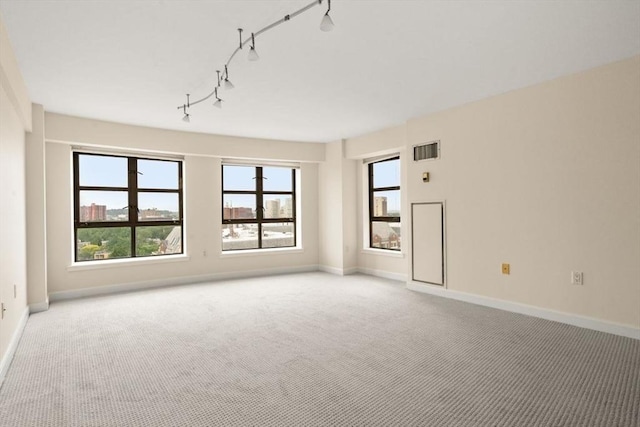 931 Massachusetts Ave Unit 1003, Cambridge, MA 02139 - empty room with carpet flooring, plenty of natural light, and track lighting